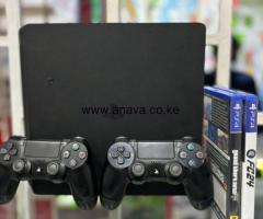 PlayStation 4 slim with original pad controllers and two extra games